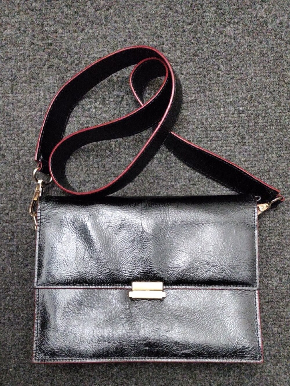 Tusk Black Shoulder/Crossbody Bag with Red-Trim